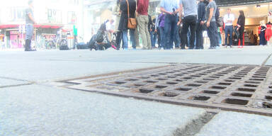 Singende Kanaldeckel in Stadt