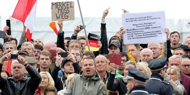 201610031744_66_81014_20161003_66_81014_161003_merkel_buh_rufe_000.jpg