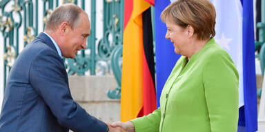Putin Merkel