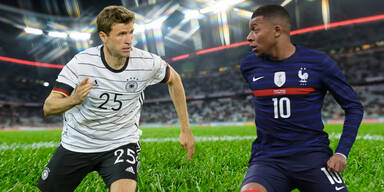 Allianz Arena in München mit Freistellern von Thomas Müller (Deutschland) und Kylian Mbappe (Frankreich)