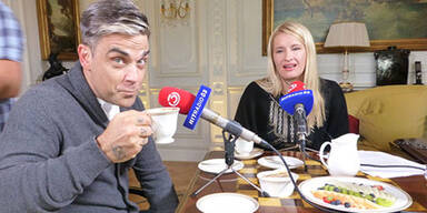 Robbie Williams und Claudia Stöckl