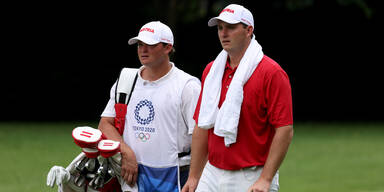 &Ouml;sterreichs Golf-Profi Sepp Straka mit seinem Caddy