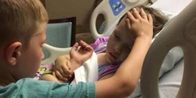 Bub h&auml;lt Hand von sterbender Schwester