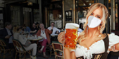 Kellnerin mit Maß Bier und Maske