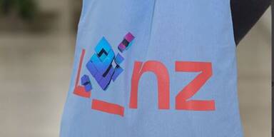 Ein Stoffbeutel mit Linz-Logo.