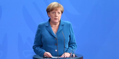 merkel_ueber_may_thump.png