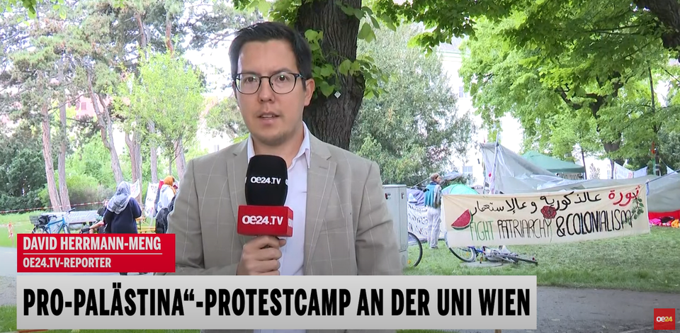 oe24.TV-Reporter David Herrmann-Meng berichtet live vor dem Pro-Palästina-Protest-Camp.