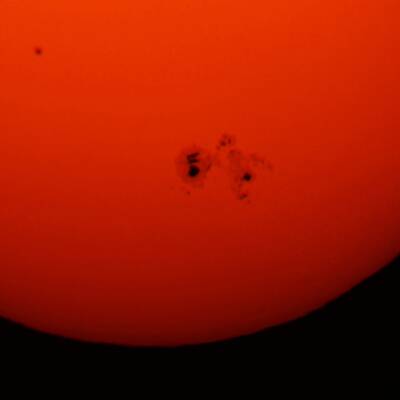 Vergleich: Sonnenfleck und Jupiter