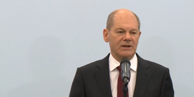 scholz bissi weniger happy at pk.PNG