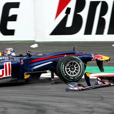 Vettel schießt Button ab