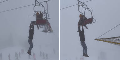 Mann baumelt in zehn Metern Höhe von Sessellift